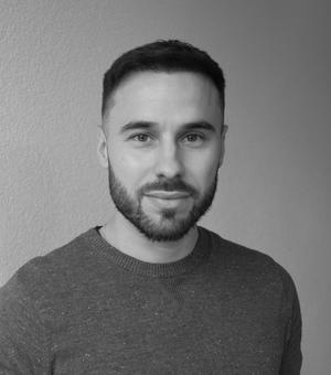 Black and white photo headshot of Christian Rodriguez