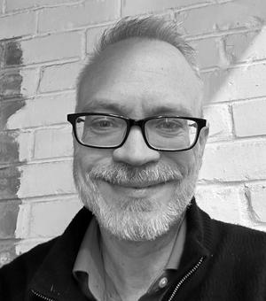 Black and white portrait photo of David Hughes